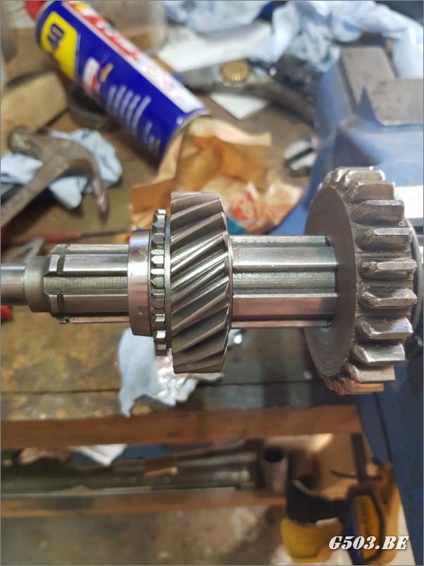 Slide the second gear onto the main shaft